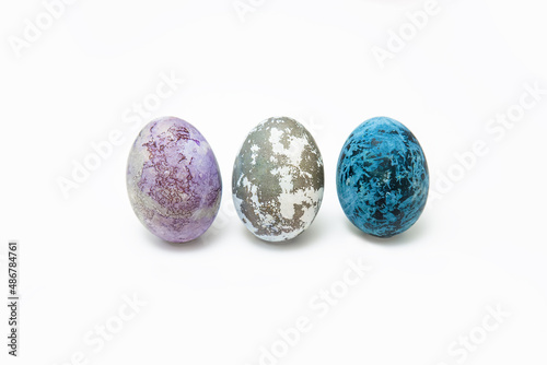 Easter eggs dyed with natural dyes. Multicolored purple, blue and marbled chicken eggs dyed with hibiscus tea.