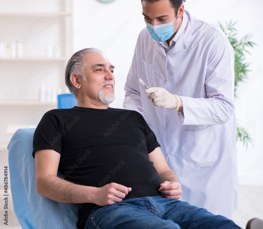 Old man visiting young doctor for plastic surgery