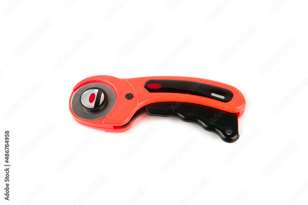 Obraz premium Rotary knife for patchwork isolated on white.