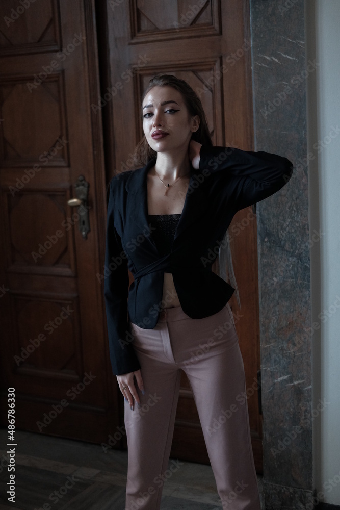 Portrait of a young girl. Elegant and melancholy portrait. Beautiful woman in classic clothes Portrait of a young girl. Elegant and melancholy portrait. Beautiful woman in classic clothes
