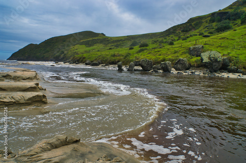 The mouth of the Kapowairua Stream at Kapowairua Campsite, Piwhane / Spirits Bay, a remote bay on the northern tip of North Island, New Zealand
