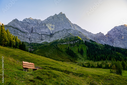 Bench in front off high mountains in austrian alps