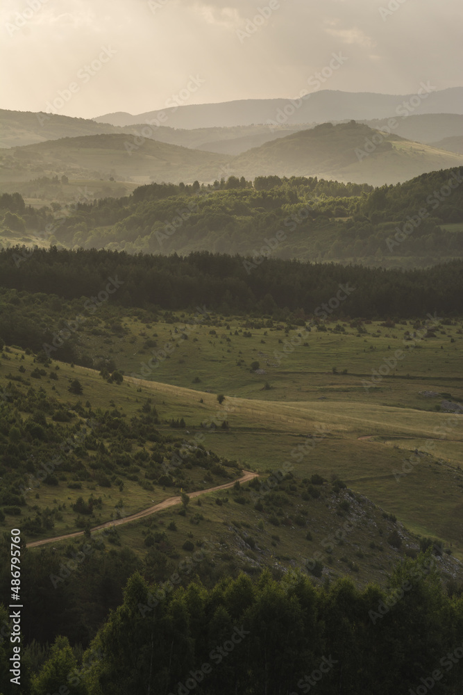 Obraz premium View of the distant hills in the early morning light, Pešterska visoravan
