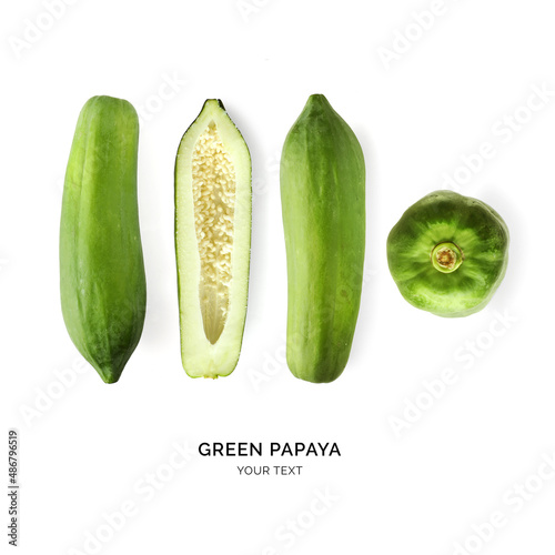 Creative layout made of green papaya on white background. Flat lay. Food concept. Macro concept.