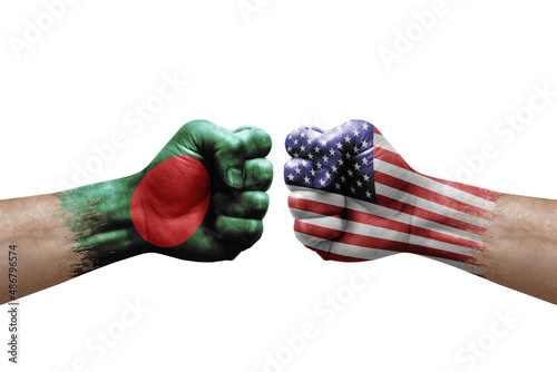 Two hands punch to each others on white background. Country flags painted fists, conflict crisis concept between bangladesh and usa