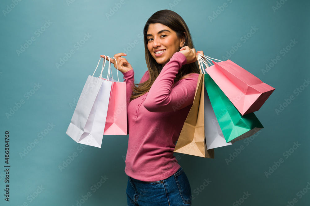 Smiling woman buying presents Smiling woman buying presents