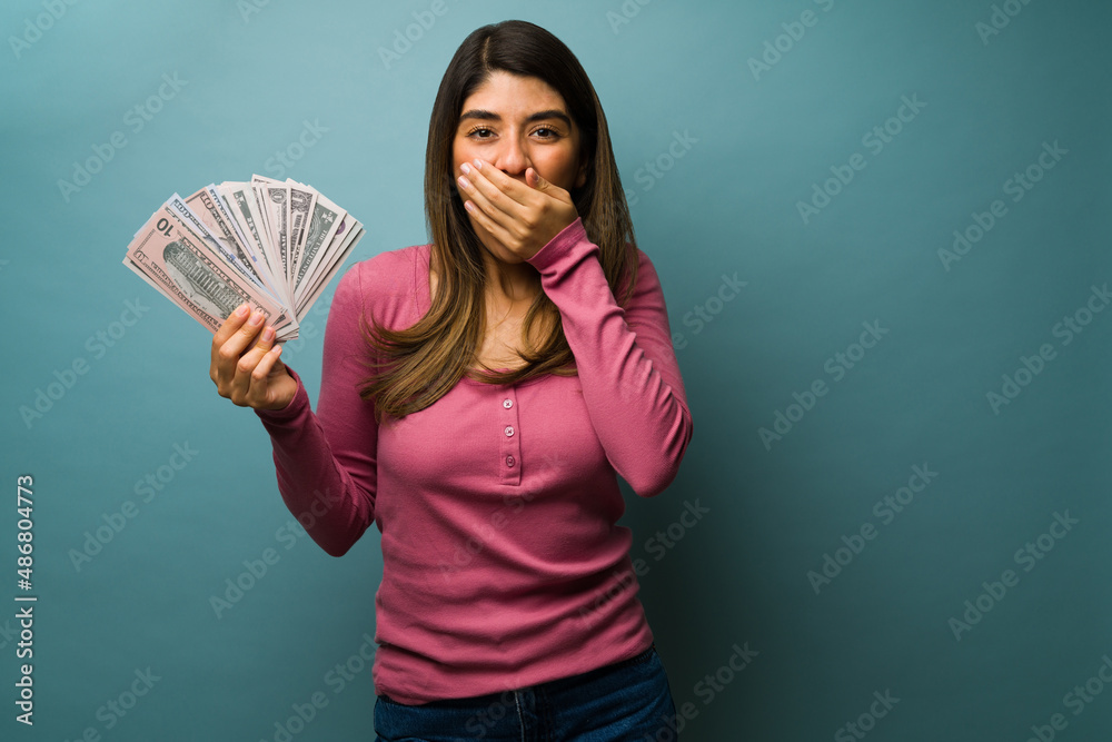 Surprised woman with a lot of cash Surprised woman with a lot of cash