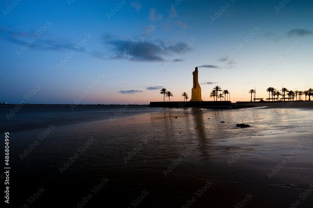 sunset over the beach with views to the monument