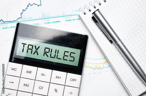 TAX RULES number on a calculator. The new year 2022 tax concept