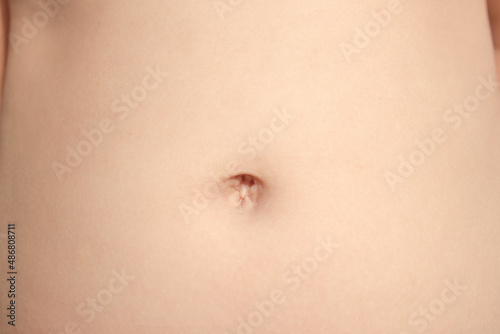 navel with skin of asian kid. photo
