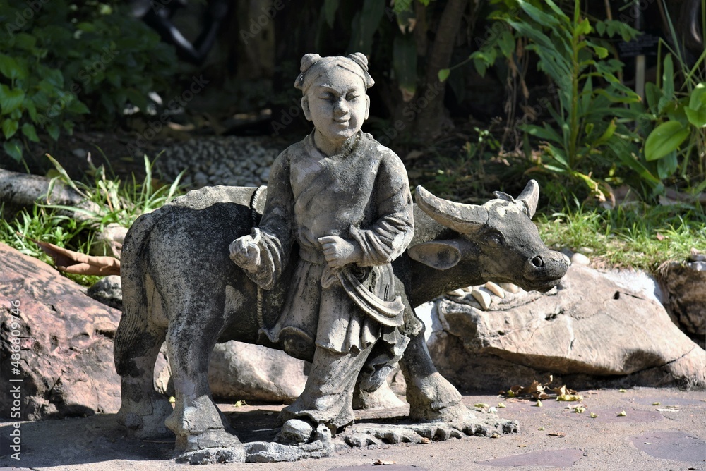 boy with buffalo stone carving in Wat Pho