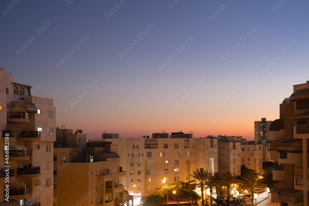 Dramatic dusk evening Israel cityscape Panoramic view from the apartment window to the district in Beersheba.