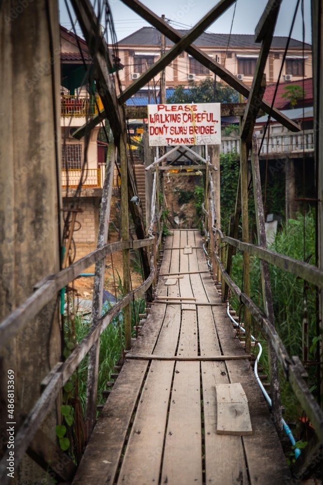 Please Walk Carefully Sign over Bridge Please Walk Carefully Sign over Bridge