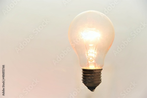 tungsten light bulb on white background photo