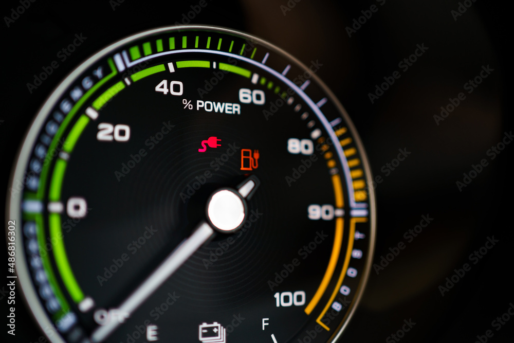 Digital modern dashboard in a electric vehicle - EV while charging at the charging station. Digital modern dashboard in a electric vehicle - EV while charging at the charging station.