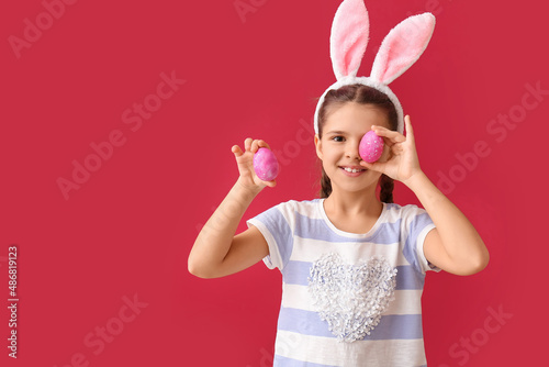 Funny little girl with bunn...