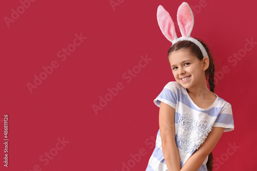 Funny little girl with bunn...