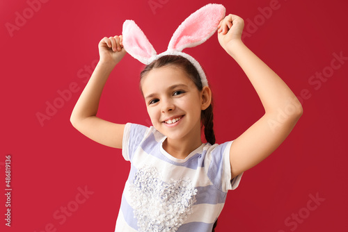 Funny little girl with bunn...