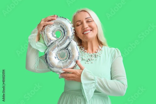 Smiling mature woman with c...