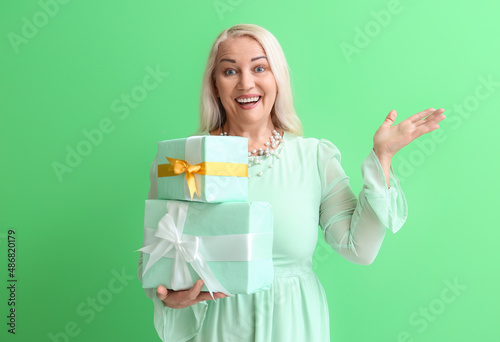Smiling mature woman holdin...