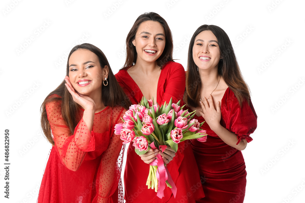 Beautiful young women with flowers on white background. International Women's Day celebration Beautiful young women with flowers on white background. International Women's Day celebration