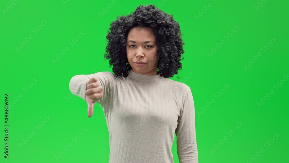 Green Screen young african female shows sing thumb down Green Screen young african female shows sing thumb down
