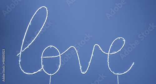 Close-up, the word love on a colored background. photo