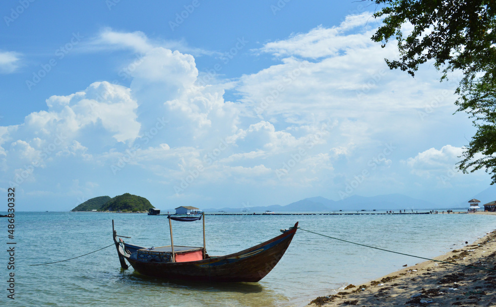 Small boat docking on the shore of Diep Son Island, Nha Trang, Vietnam