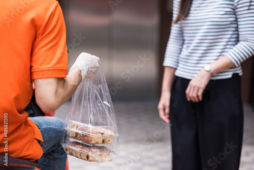 deliveryman deliver sweet bakery to customer