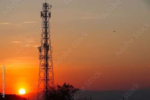 Transmission tower with sunset in the evening, wide of sunset view 