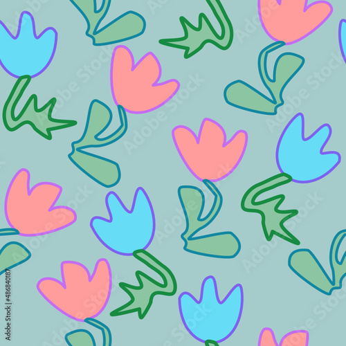 Seamless pattern of abstract blue and pink flowers on a green background for textile.