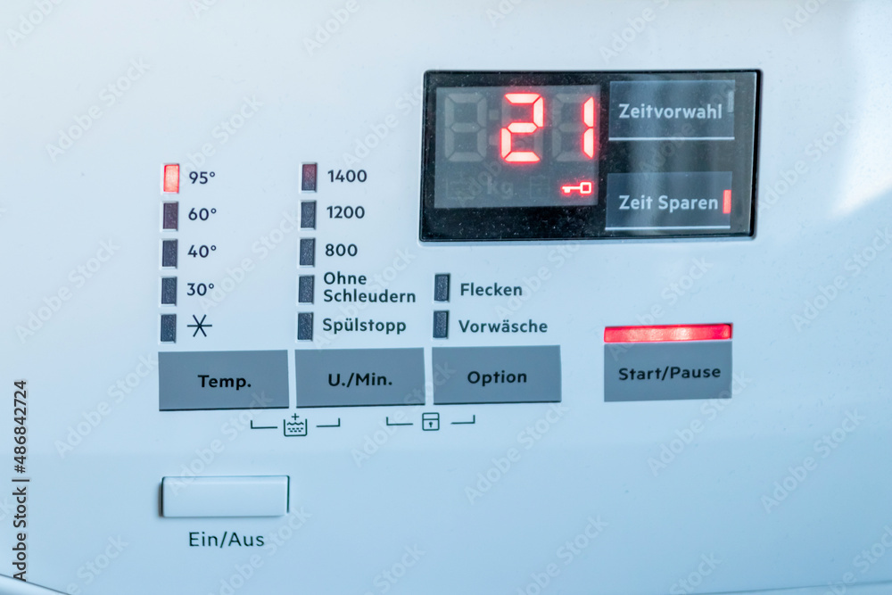 Detail view of washing machine control panel with contemporary thermostat and program selection to switch between different programs for laundry cleaning in modern household for housekeepers hygiene Detail view of washing machine control panel with contemporary thermostat and program selection to switch between different programs for laundry cleaning in modern household for housekeepers hygiene