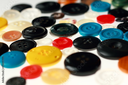 Multicolored different size buttons for clothes.