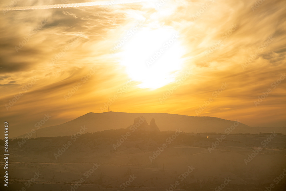 Fototapeta premium The longest sunset in Cappadocia is watched from the Red Valley. Nevsehir, Turkey