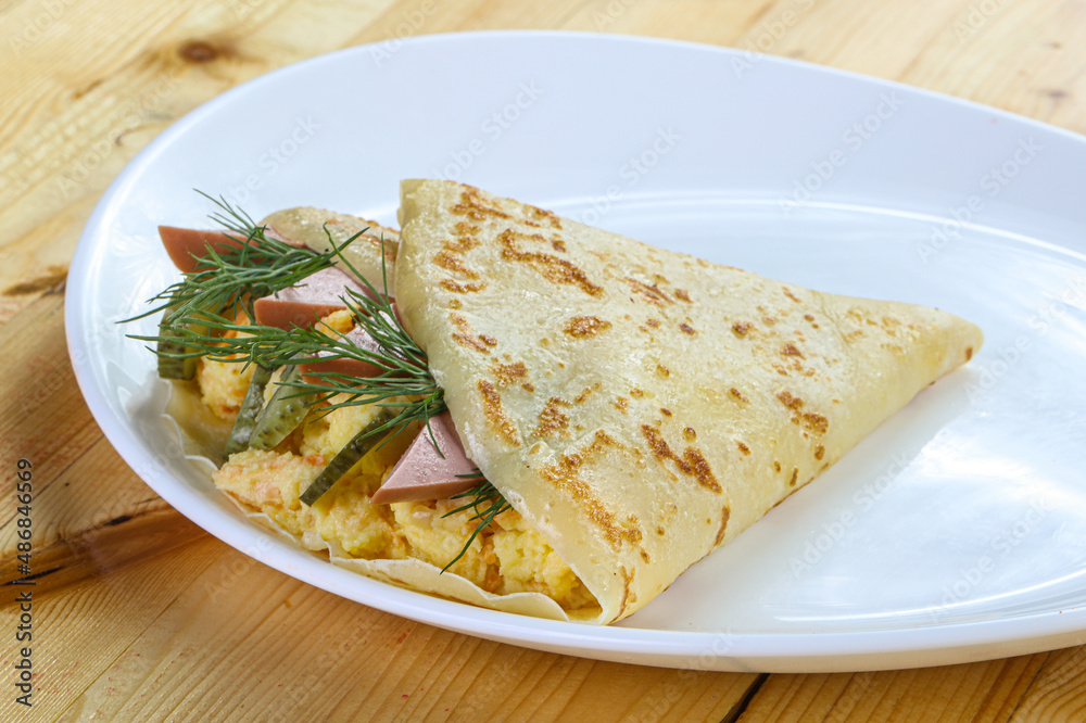 Pancake with potato and sausages Pancake with potato and sausages