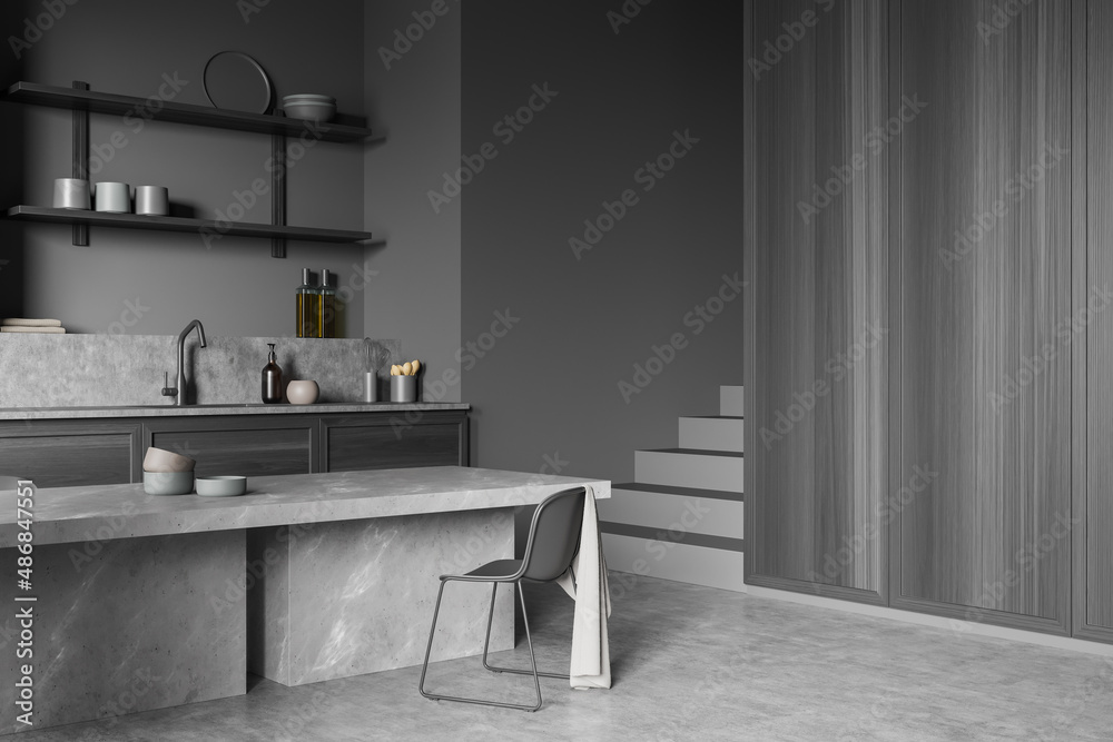 Top view of dark kitchen interior with table and stairs, kitchenware