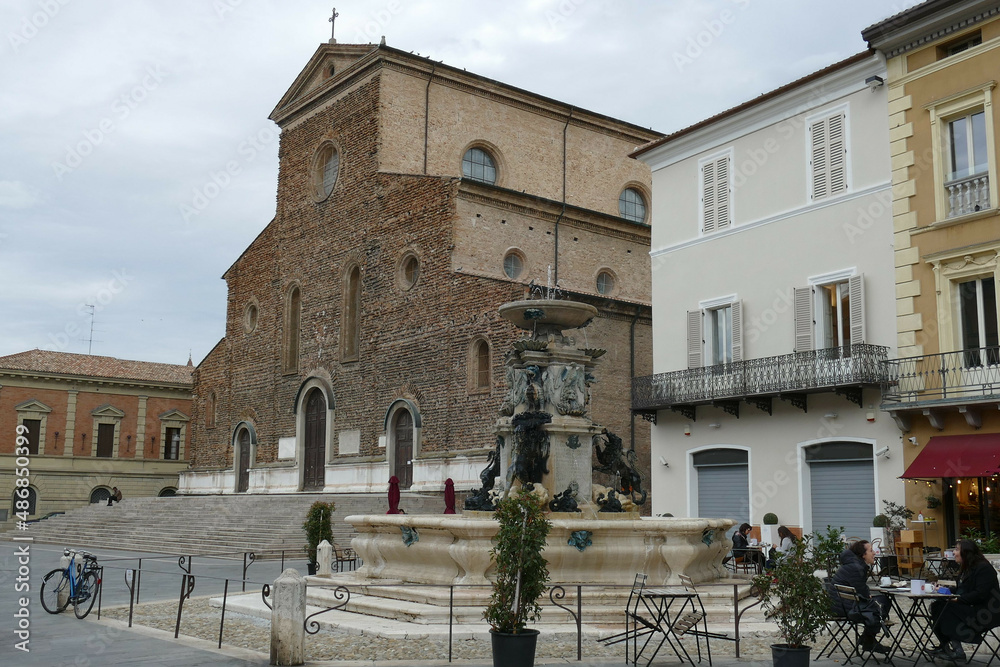 the monumental fountain in Faenza with St. Peter Cathedral in the background