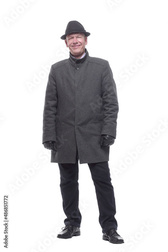 intelligent man in a hat and autumn coat. isolated on a white background. © ASDF