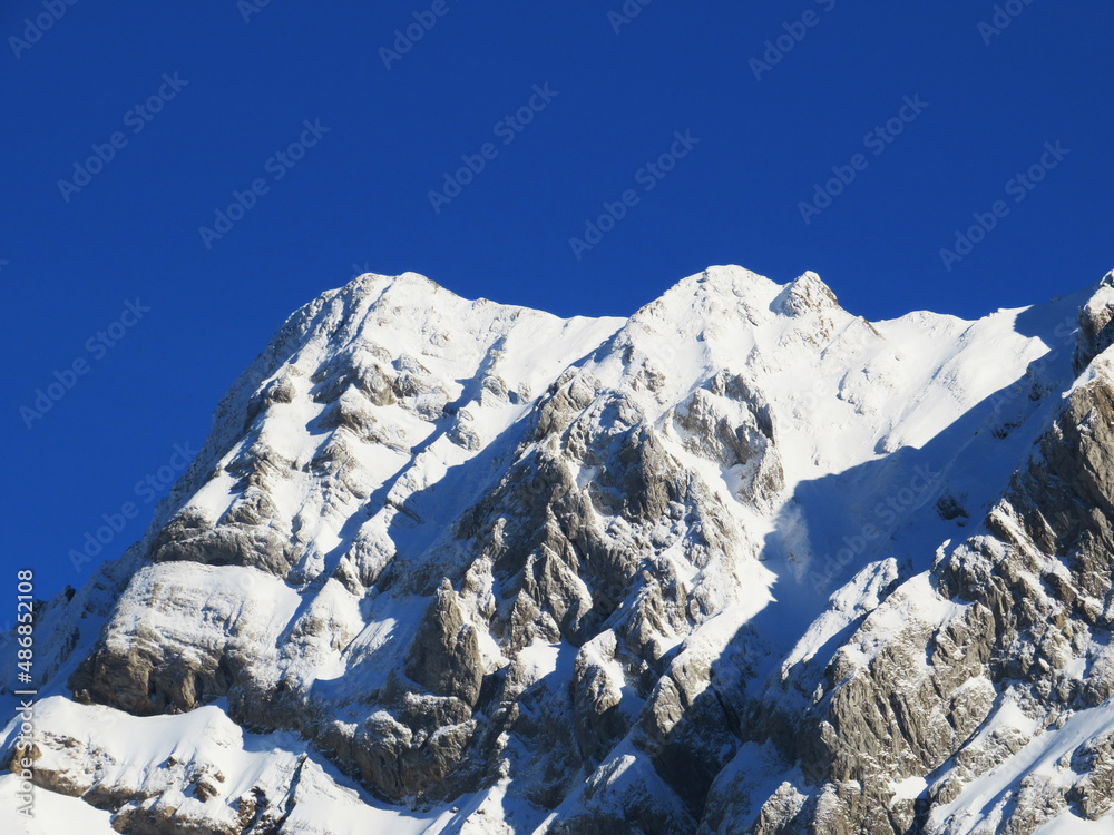 Winter ambience and beautiful idyllic atmosphere on the steep alpine rocky peak Grenzchopf (2193 m.a.s.l.) and the mountain Alpstein - Appenzell Alps massif - Switzerland (Schweiz)