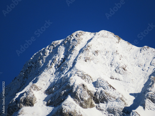 Winter ambience and beautiful idyllic atmosphere on the steep alpine rocky peak Grenzchopf (2193 m.a.s.l.) and the mountain Alpstein - Appenzell Alps massif - Switzerland (Schweiz) photo