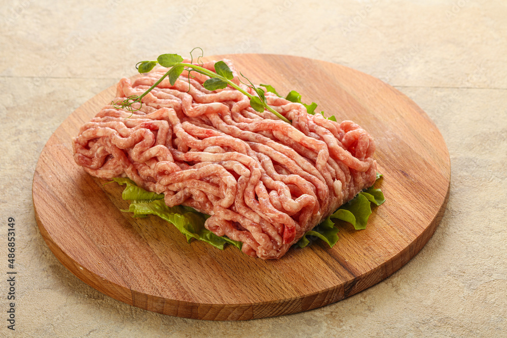 Raw minced pork meat over board Raw minced pork meat over board