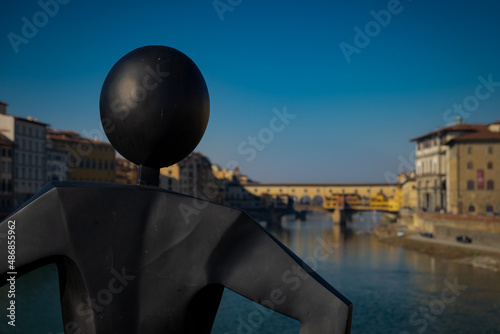 The common man statue and the Old Bridge in Florence, Italy