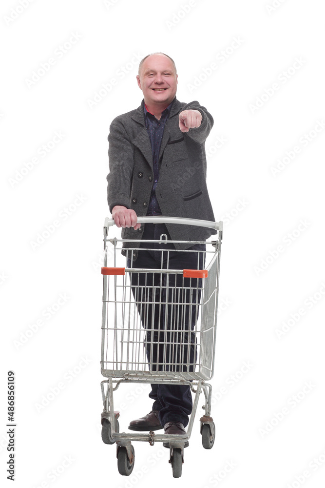 smiling casual man with shopping cart .isolated on a white background. smiling casual man with shopping cart .isolated on a white background.