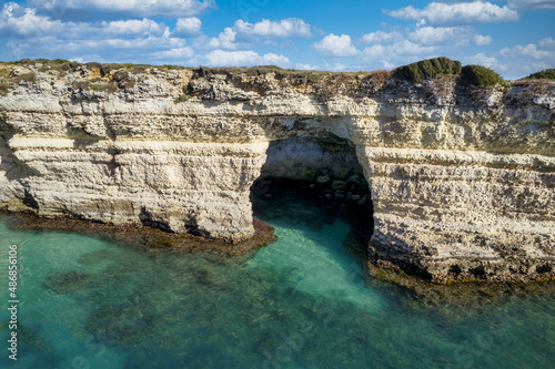 Seacoast of Otranto, Puglia, Salento, Italy. Turquoise sea, clear blue sky, rocks, sun, Tourist Apulia, Aerial View Sea