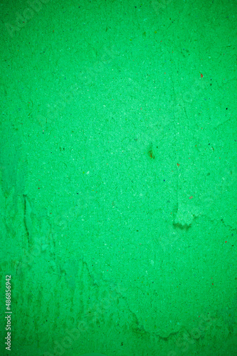 Green torn paper recycling cardboard texture. © peterkai