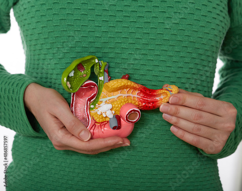 Woman suffering from pain in pancreas area and gallbladder. Treatment of pancreatic diseases, acute and chronic pancreatitis