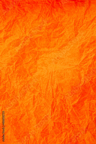Crumpled vintage Orange paper textured obsolete background.