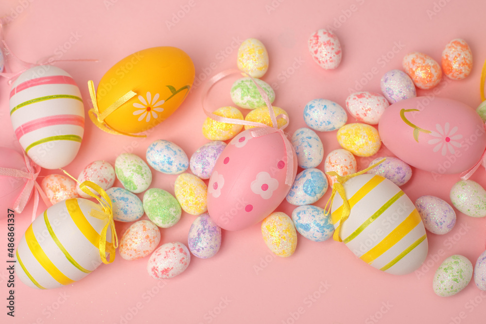 Top view shot of arrangement decoration Happy Easter holiday background concept. Flat lay colorful bunny eggs with ornament on pink paper, Design pastel tone. Banner, flyer, greeting card