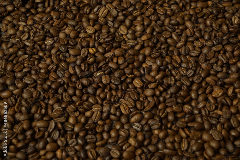 Coffee beans on the wooden table Coffee beans on the wooden table