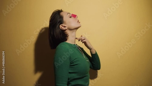 a young woman of European appearance demonstrates her small nose and mouthguard photo